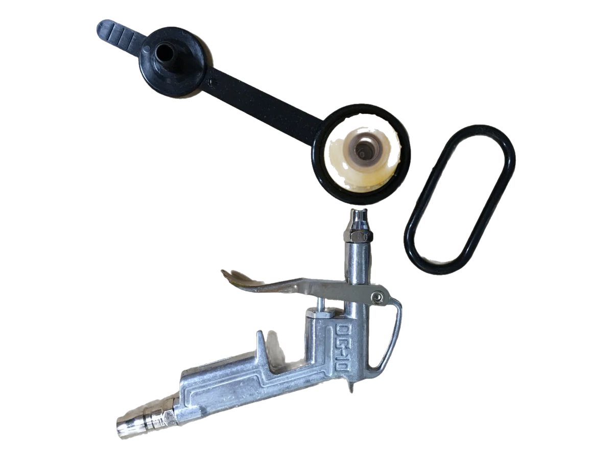 Pistola de inflado de aluminio junto a una válvula estándar de rosca amarilla